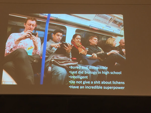 Image of people on a train looking at their phones
